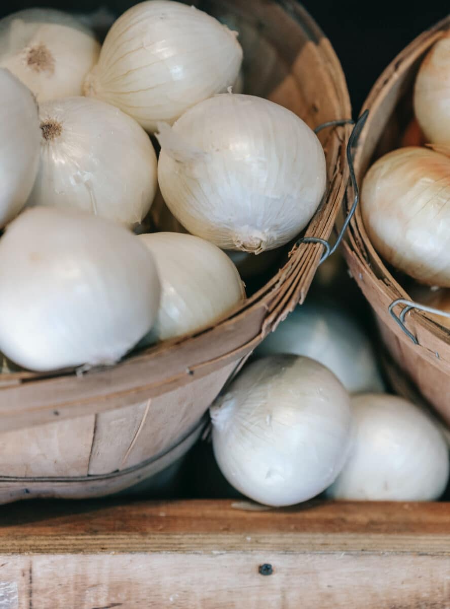 white onions in baskets