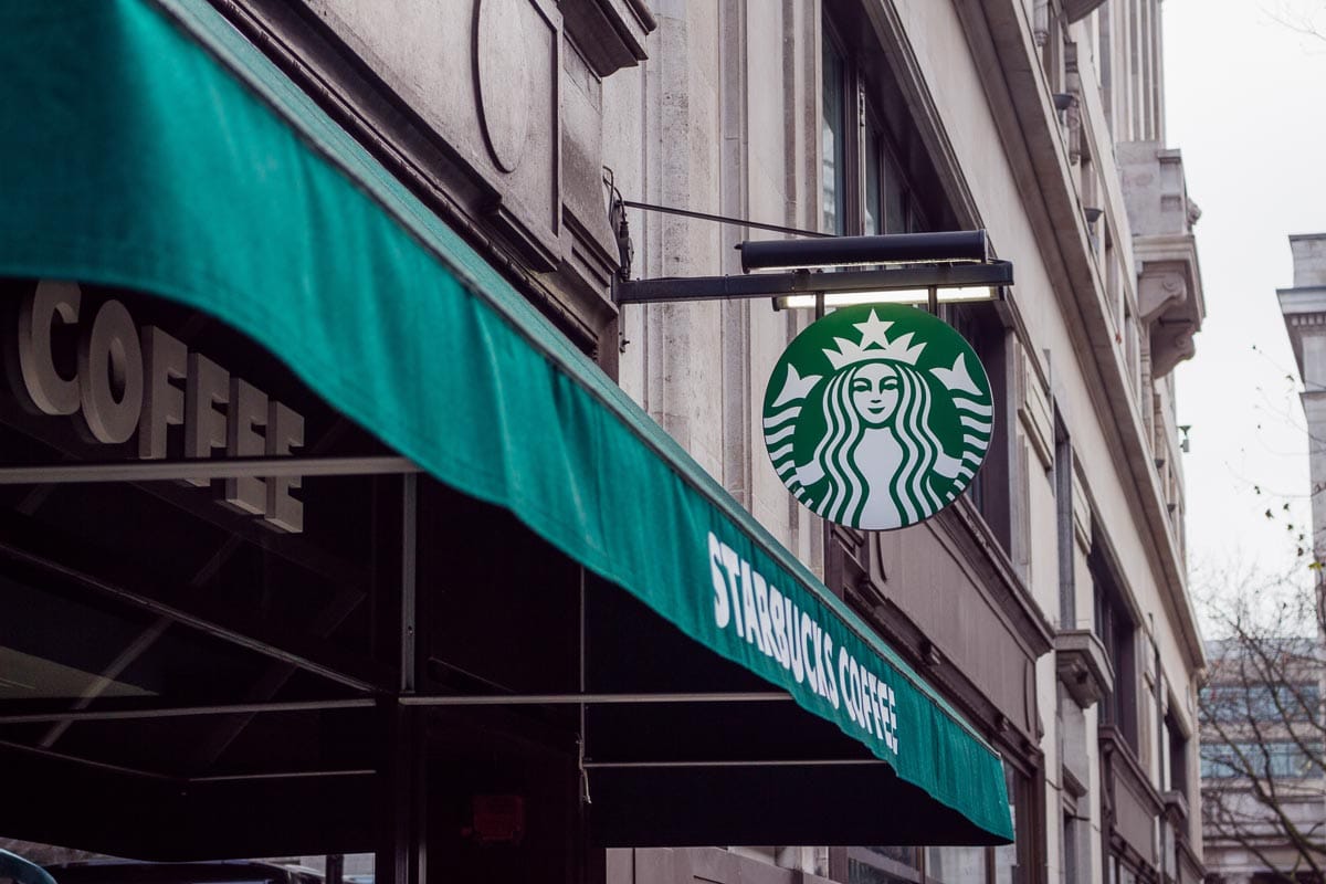 Starbucks logo and awning in city setting