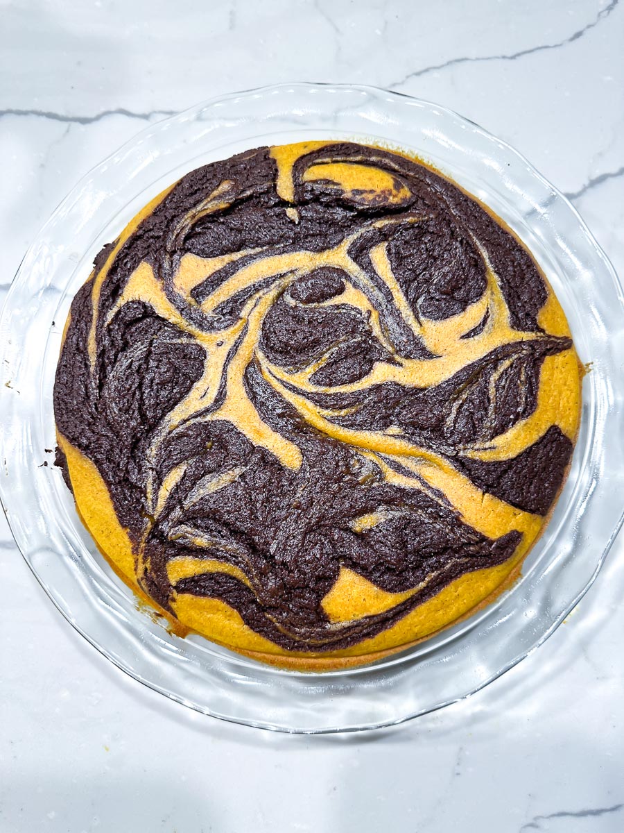 Low FODMAP Pumpkin Swirl Brownie Pie in pan cooling, freshly baked