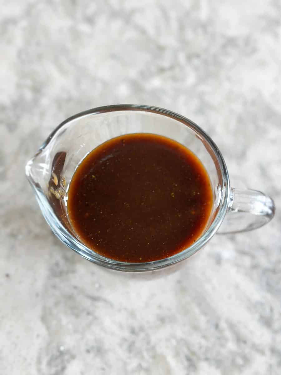 looking down into pitcher of Low FODMAP Steak Sauce on grey granite counter