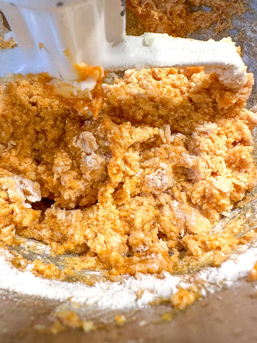 pumpkin muffin batter with flour added, partially mixed