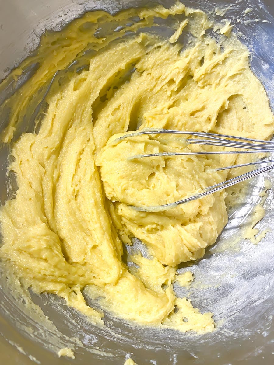 making yellow sponge cake in metal bowl, with whisk-2