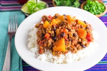 Low-FODMAP-Turkey-Chili-with-Winter-Squash-Beans-with-rice-in-a-white-bowl.
