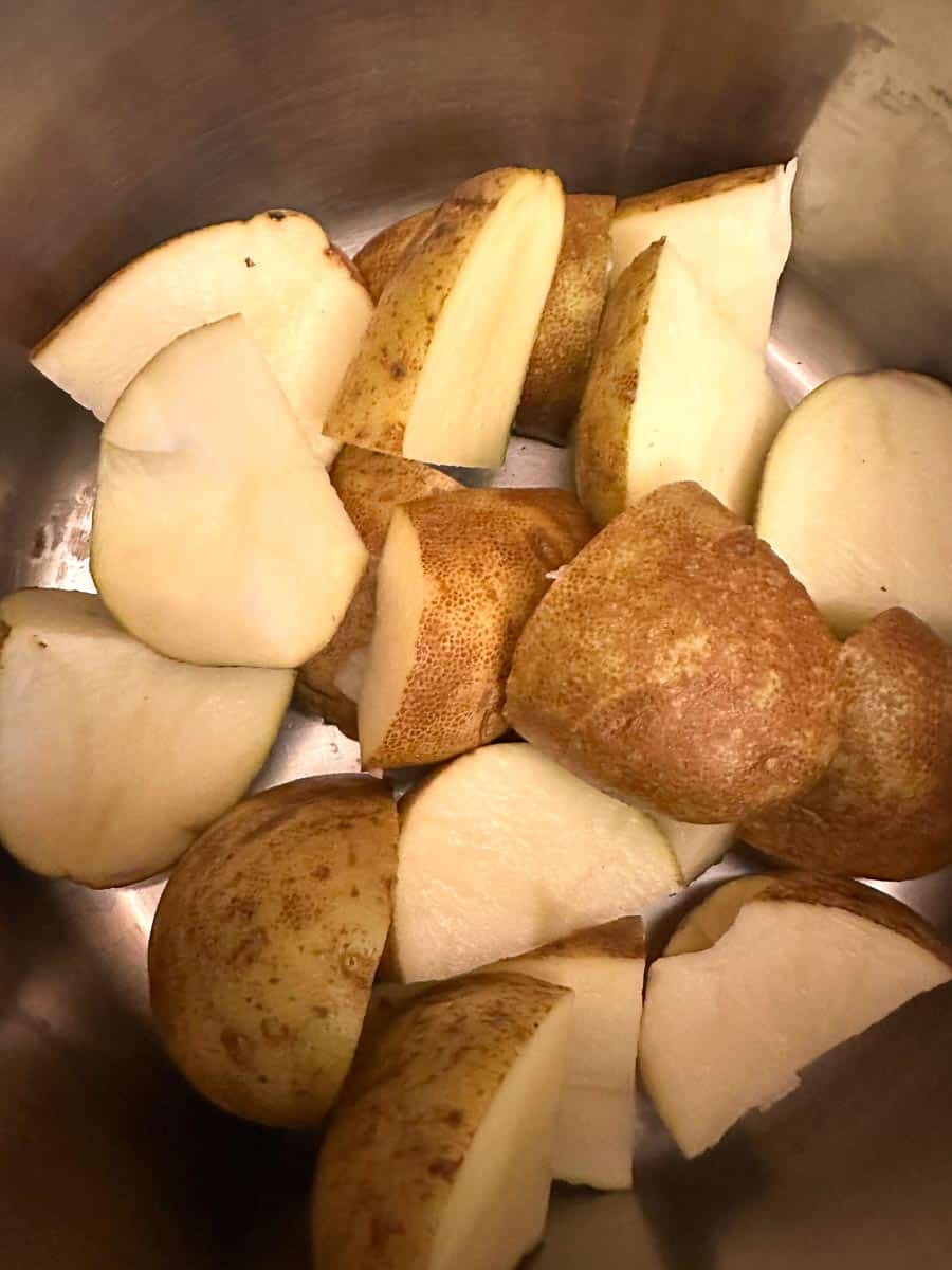 chunks of russet potatoes in pot