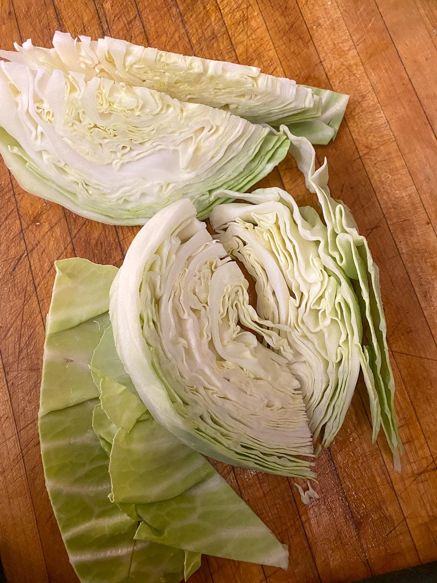 wedges of cabbage on wooden board