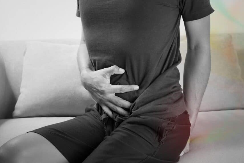 man holding stomach and butt. Gas. fart. tharakorn via 123rf