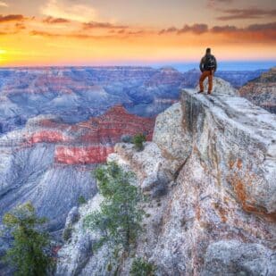 man standing at the Grand Canyon
