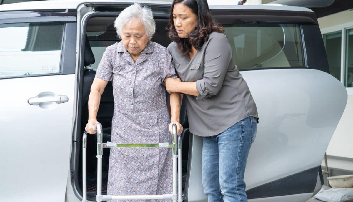 young woman assisting an older woman