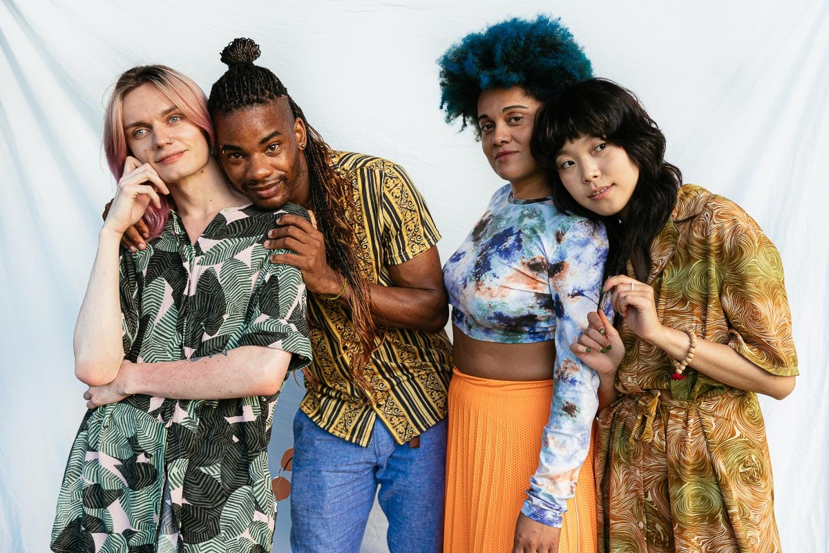 group of young adults in colorful clothing.