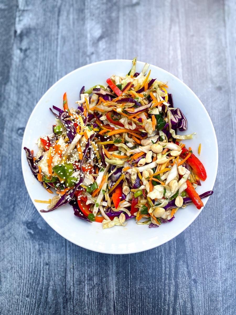 low FODMAP Asian inspired slaw on white plate.