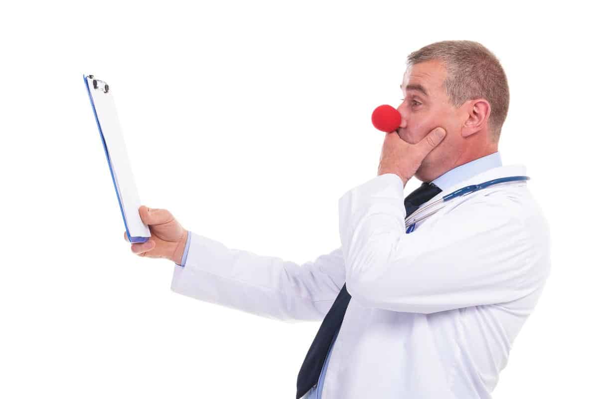 man with red clown nose on.
