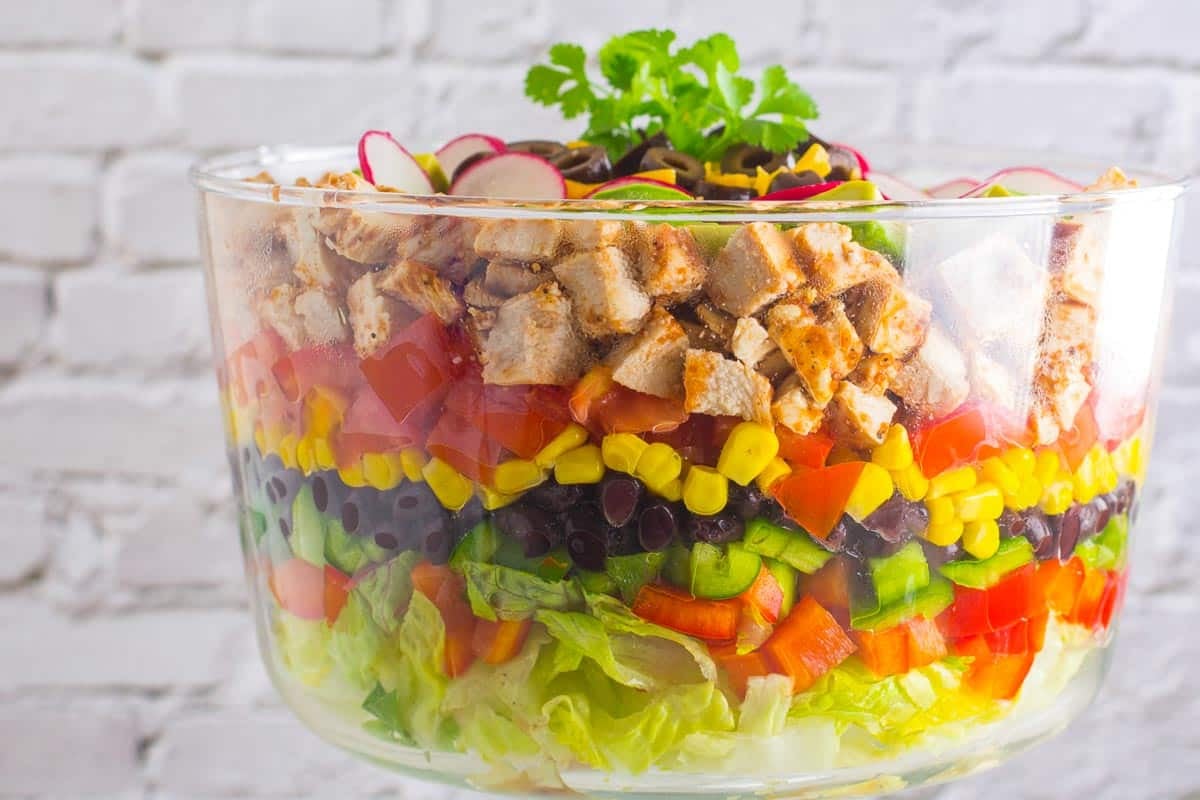 closeup Chopped BBQ salad in clear glass bowl.