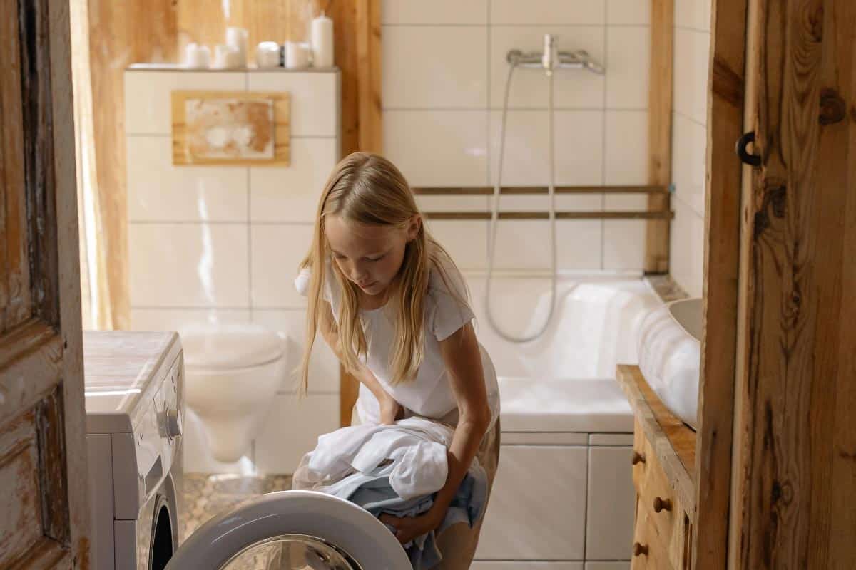 girl doing laundry.