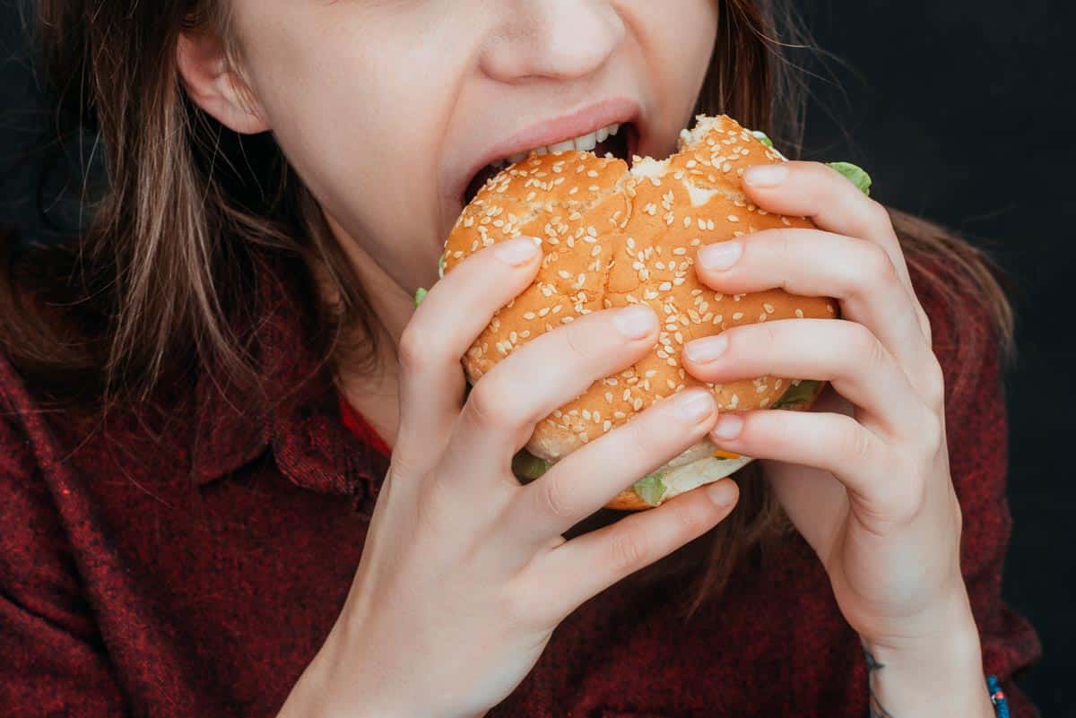 girl eating burger.