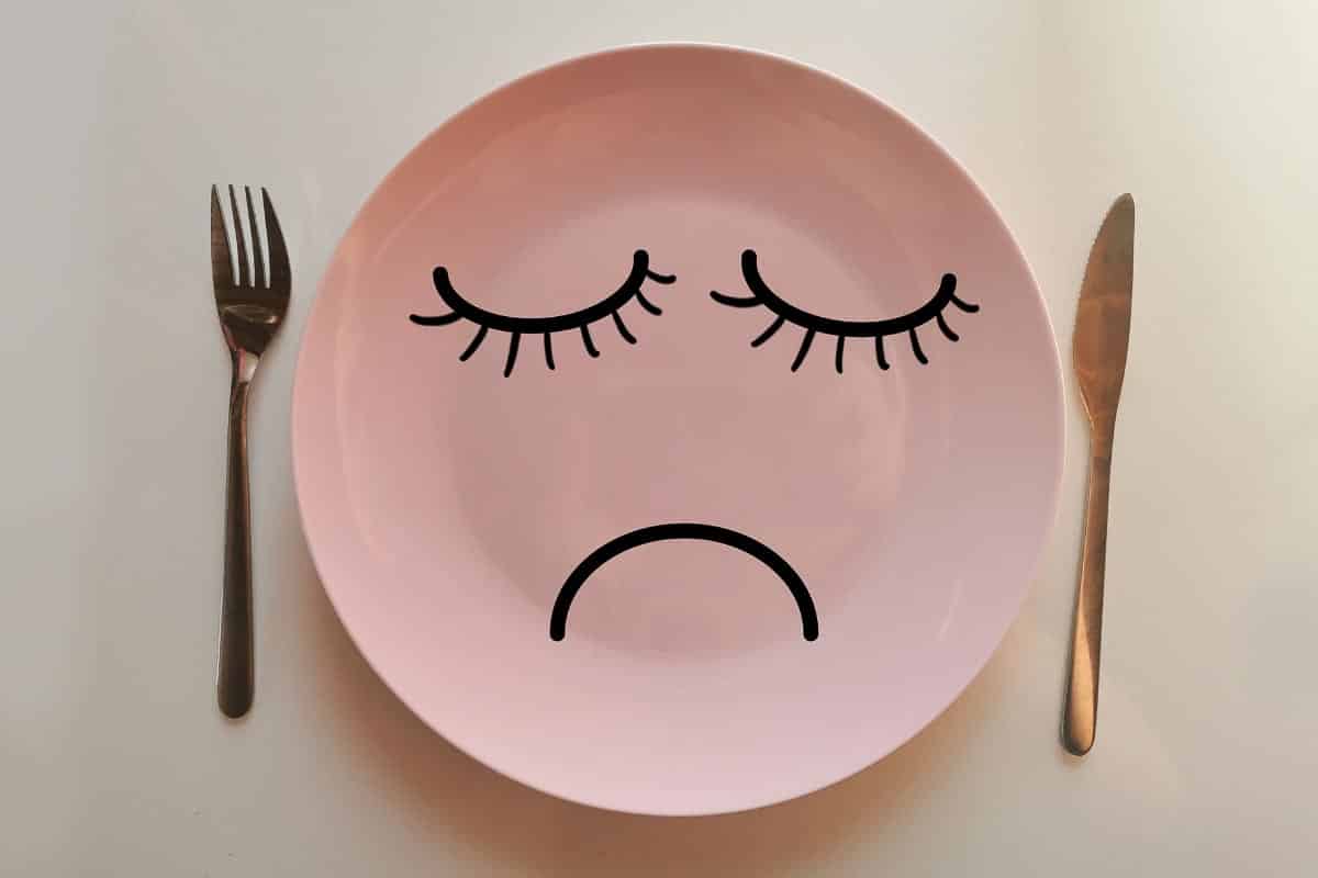 plate with sad face.