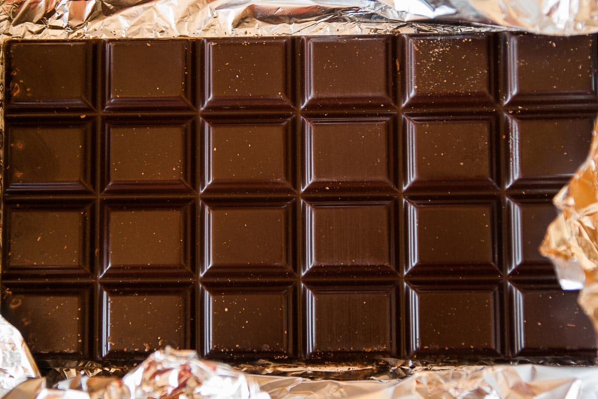 unwrapped dark chocolate bar.