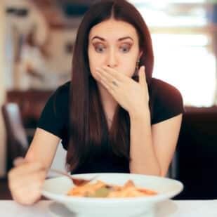 woman disgusted at food.