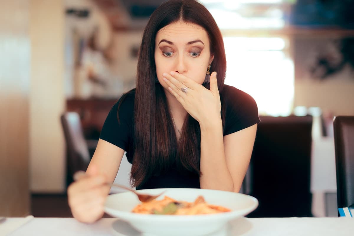 woman disgusted at food.