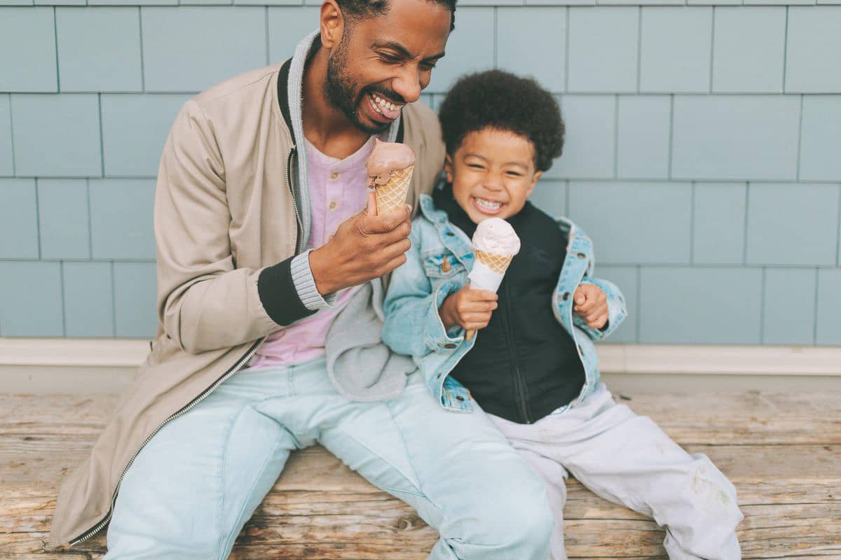 man and child eating ice cream.