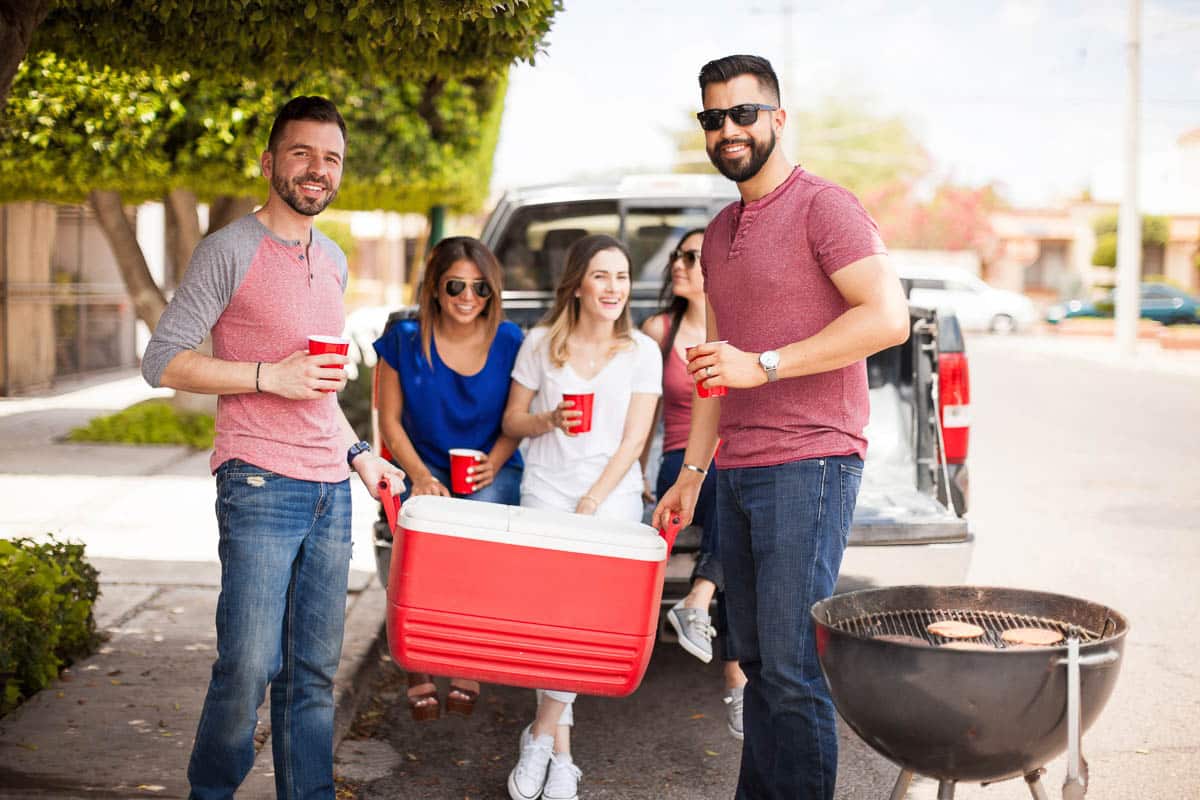 people with red cooler.
