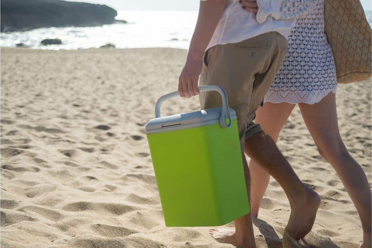 two people with green cooler.