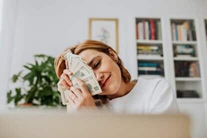 woman caressing herself with money.