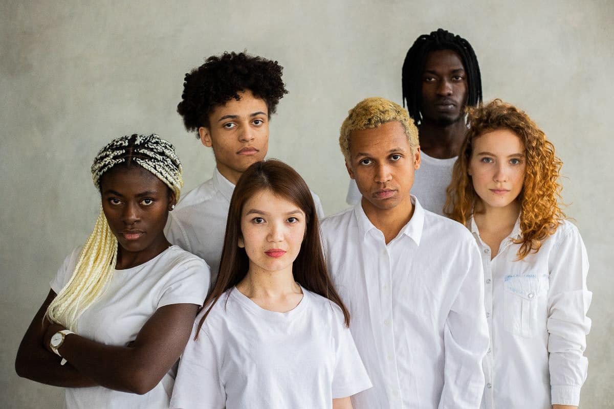 young adults dressed in white.
