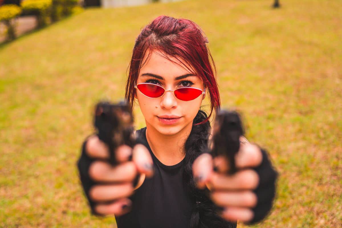 young woman with guns.