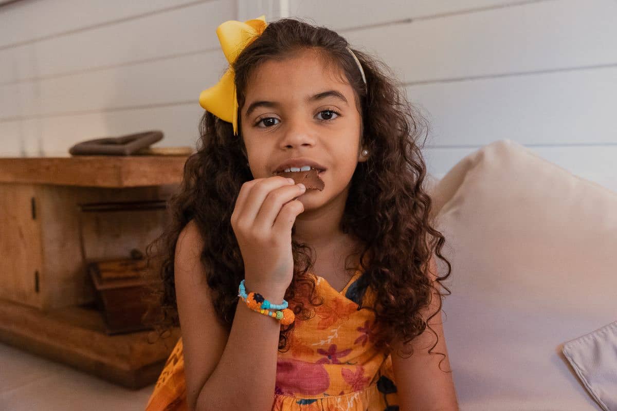 Girl eating cookie.