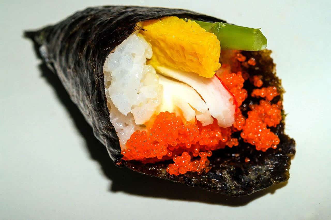 Hand roll of sushi. Temaki.