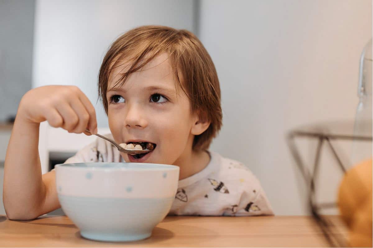 boy eating cereal.