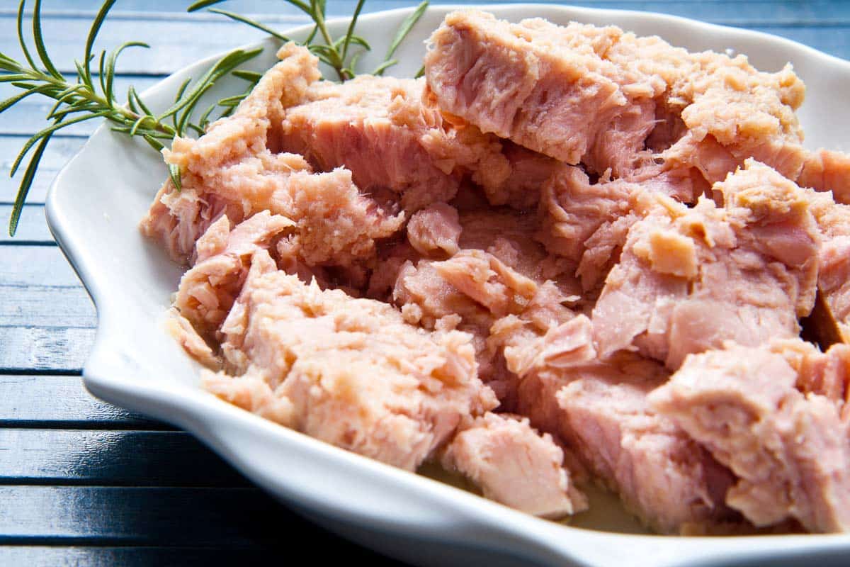 canned tuna fish on white plate.