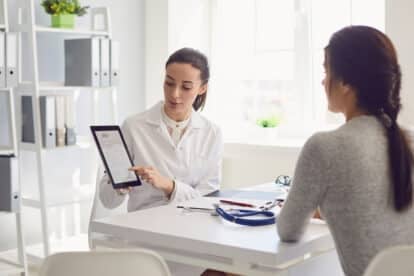 doctor and patient looking at RX.