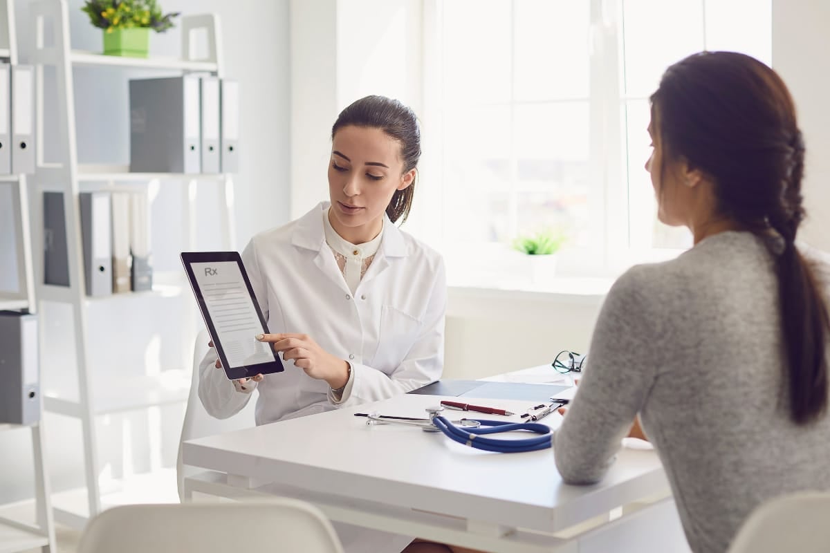 doctor and patient looking at RX.