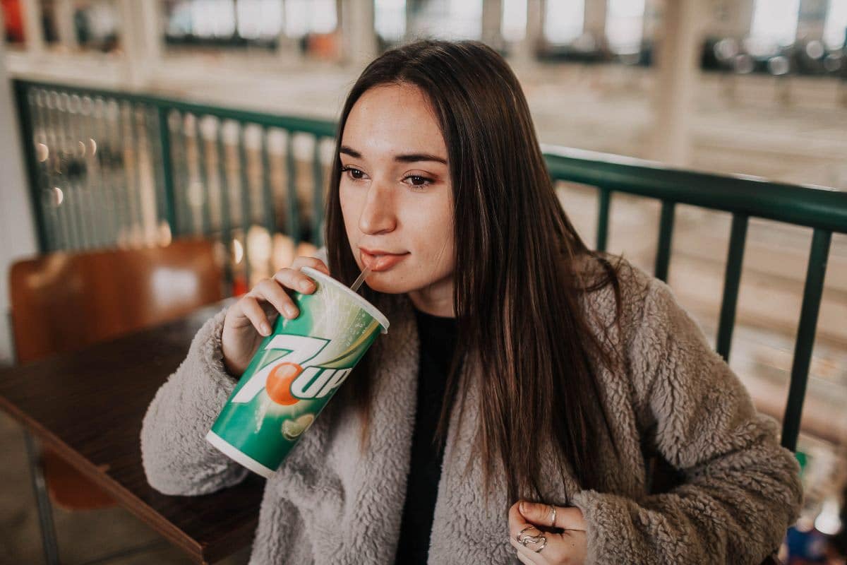 woman drinking soda.