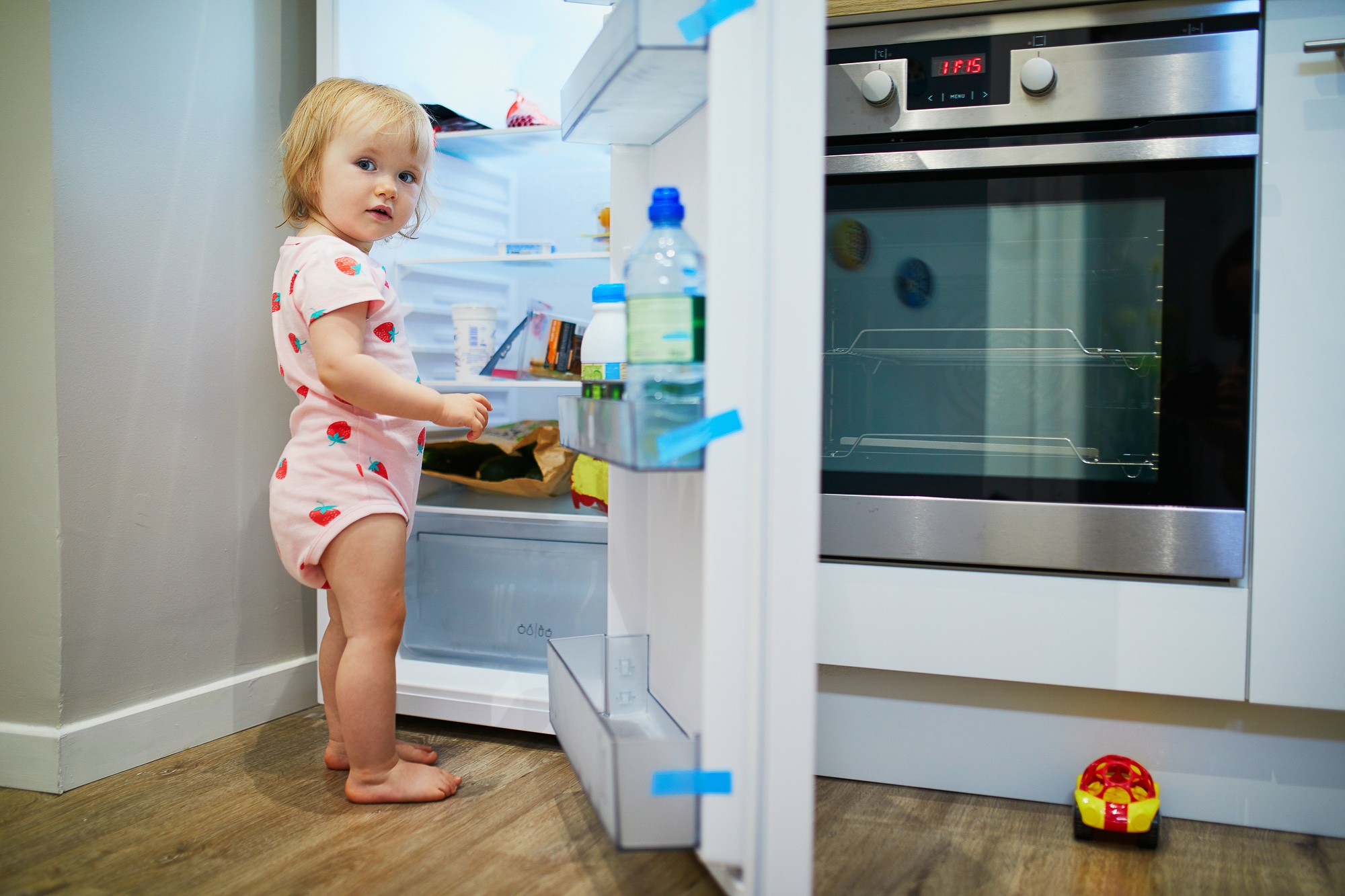 child at refrigerator.