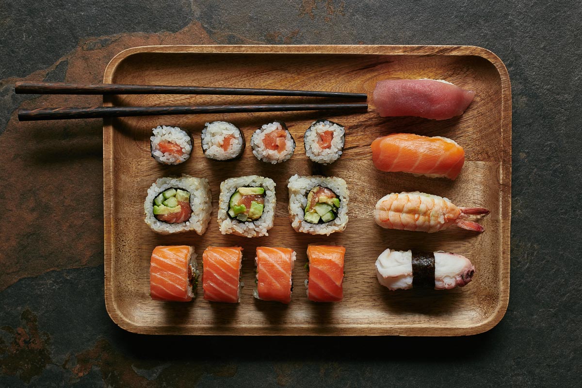 sushi on a wooden platter.