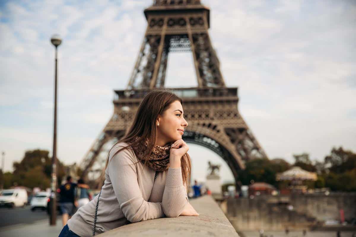 woman in front of Eiffel tower.