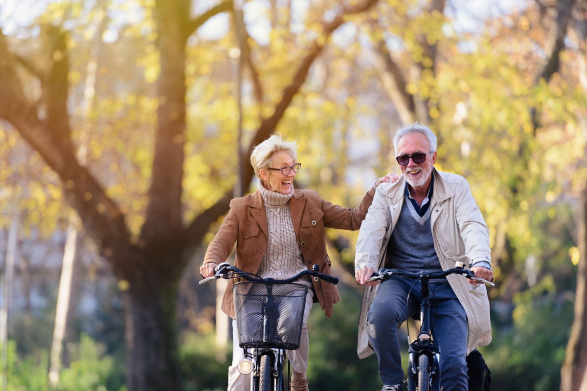 Older couple on bikes