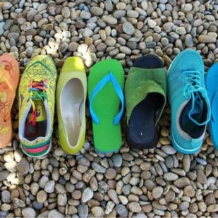 colorful shoes on pebbles