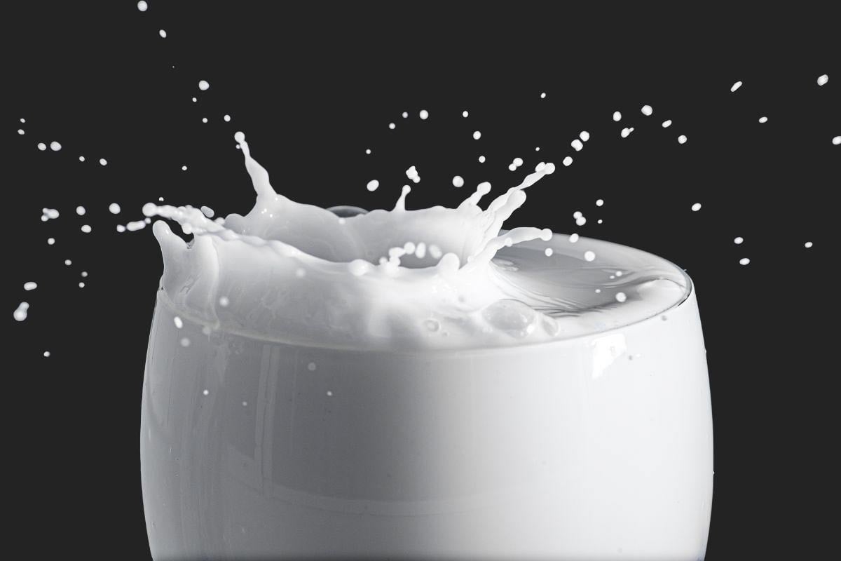 milk splashing in glass.