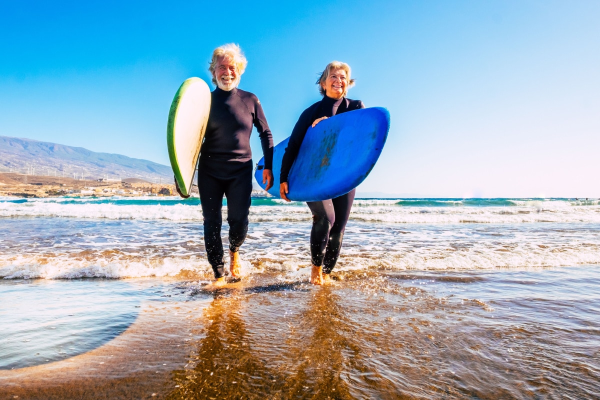 older couple surfing happy