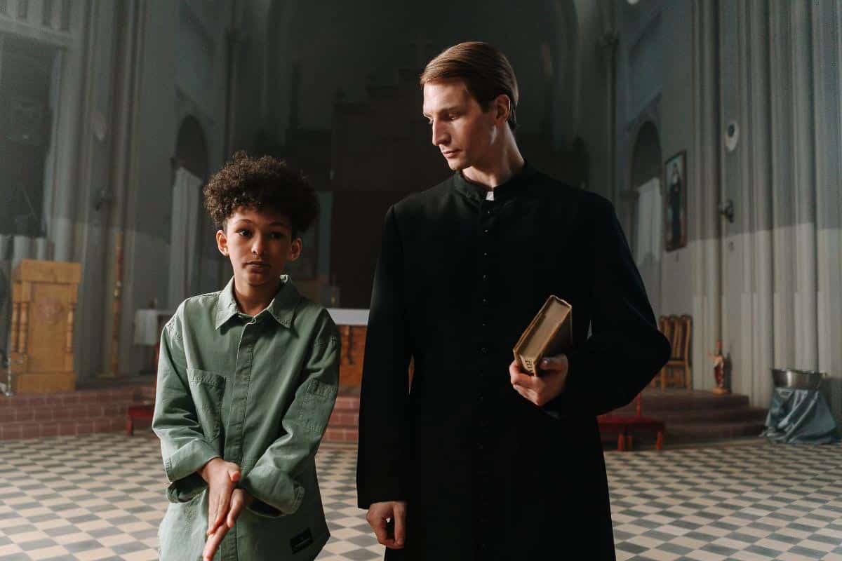 priest and kid.