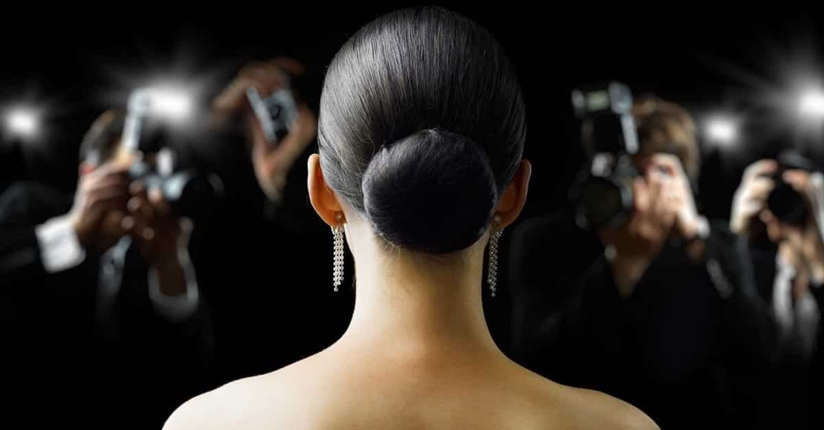 Back of female movie star's head with paparazzi Shutterstock_65658268 Photo credit: Yuganov Konstantin via Shutterstock.
