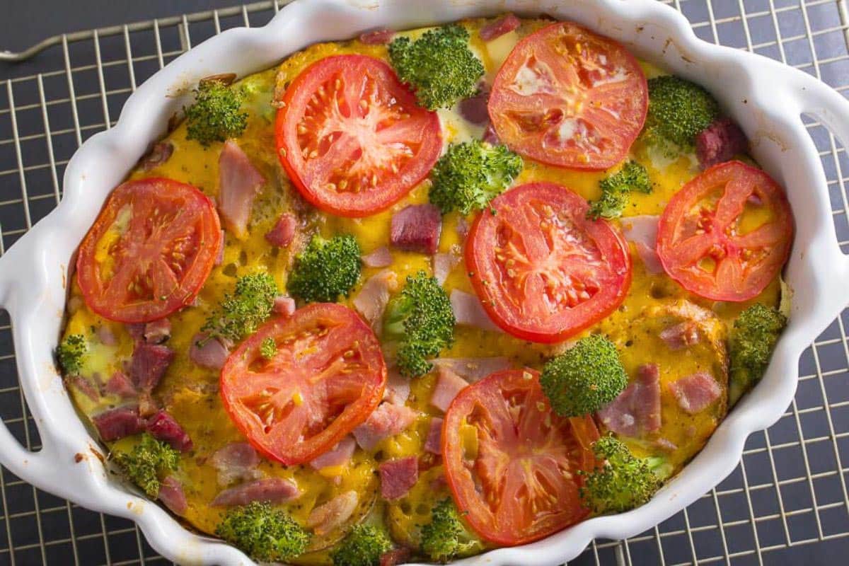 Low FODMAP Ham & Cheese Savory Bread Pudding in oval casserole.