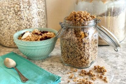 Low FODMAP High Protein Quinoa & Oat Granola in jar and aqua bowl