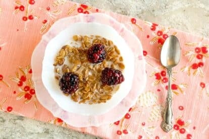 5-Ingredient Low FODMAP Maple Walnut Granola in bowl with blackberries