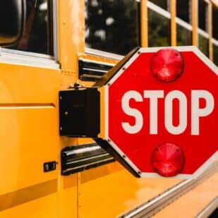 Yellow school bus stop sign.