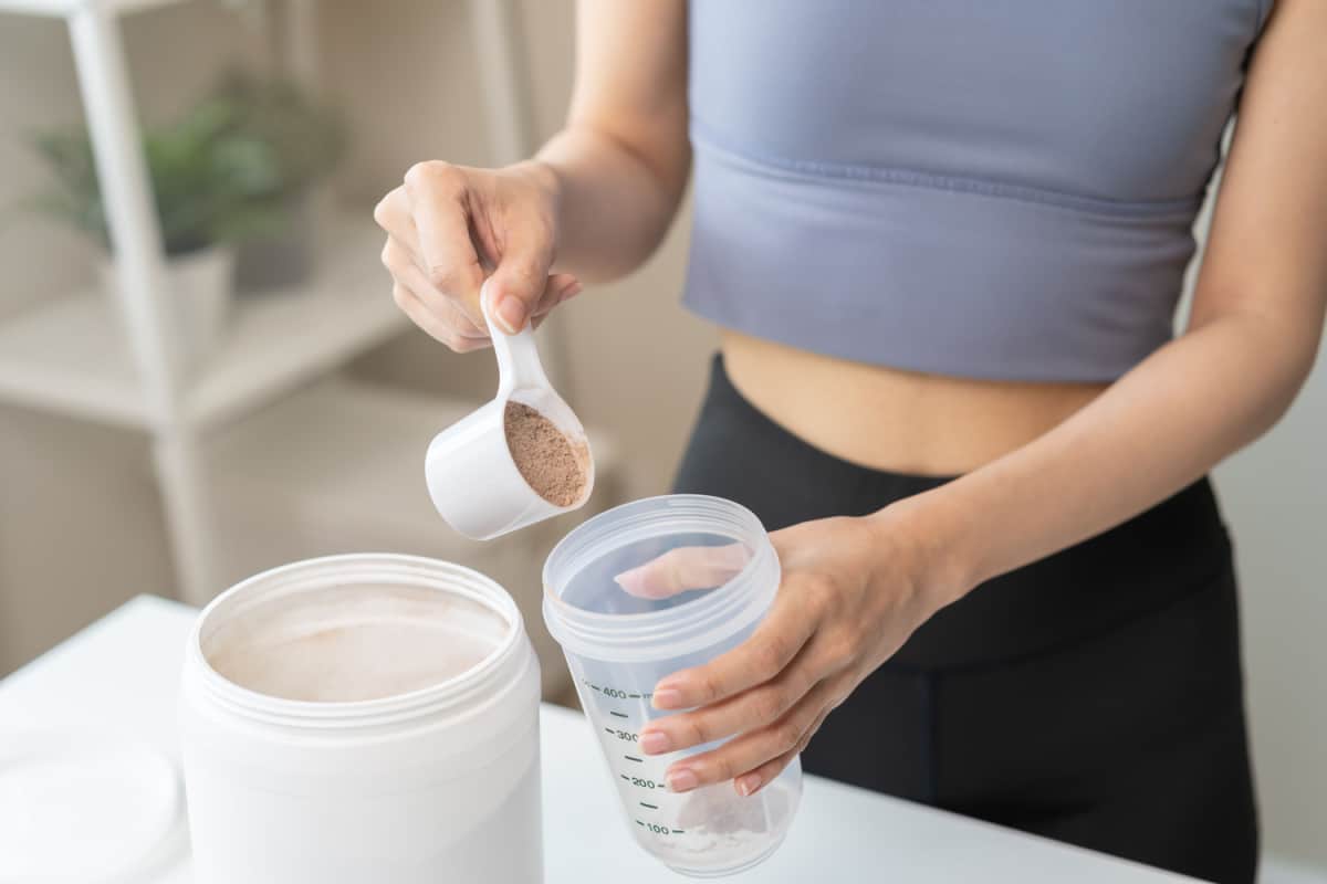 woman making protein shake. 