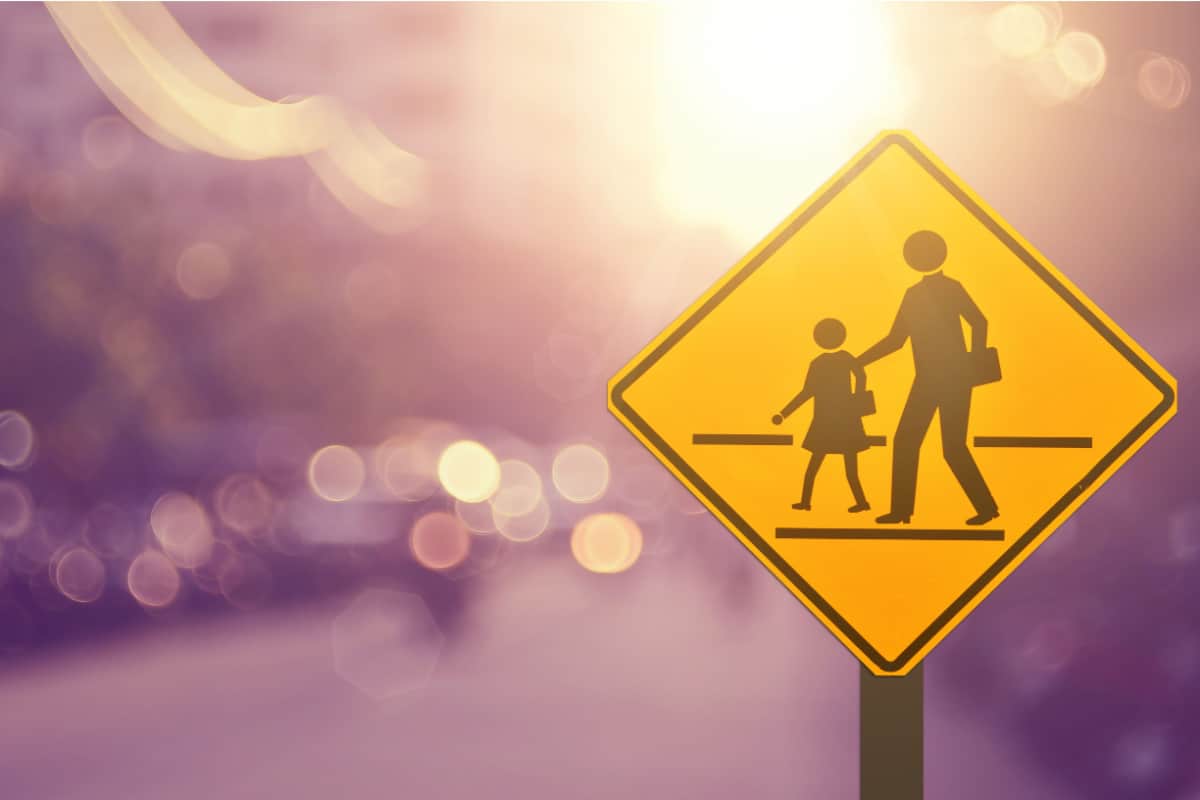 School sign.Traffic sign road on blur road abstract background..